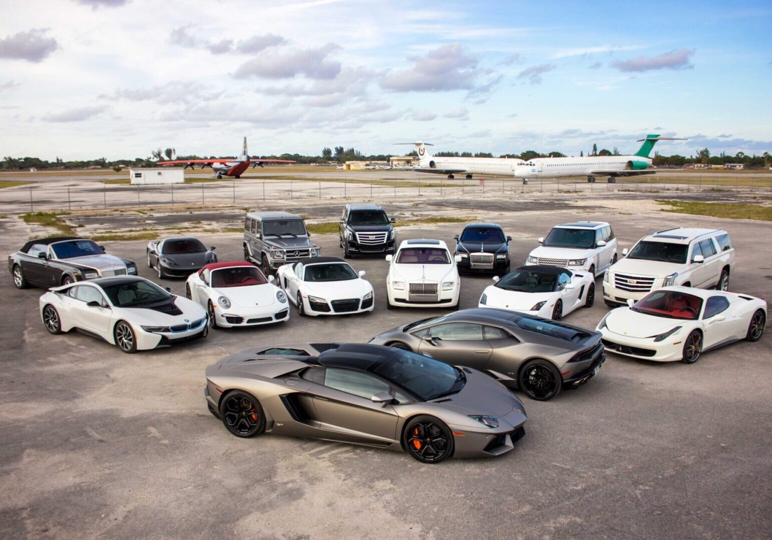 A group of cars parked in a parking lot.